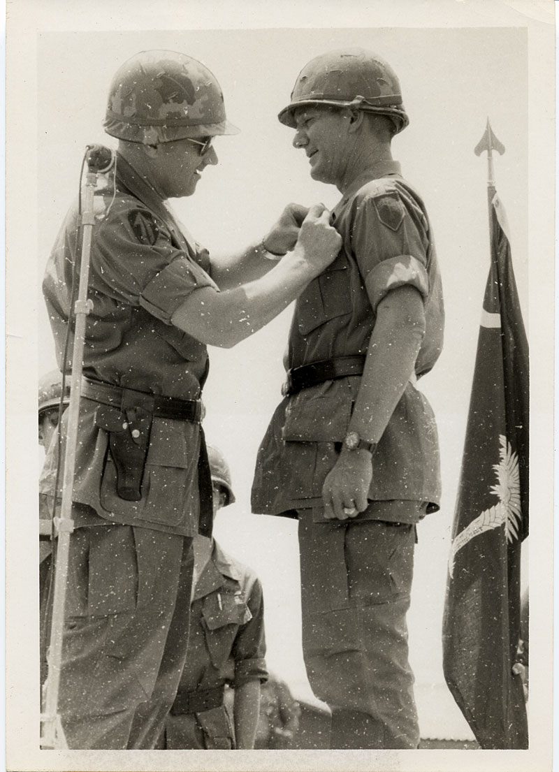 Major General Keith Ware presents Brigadier General William S. Coleman with awards.